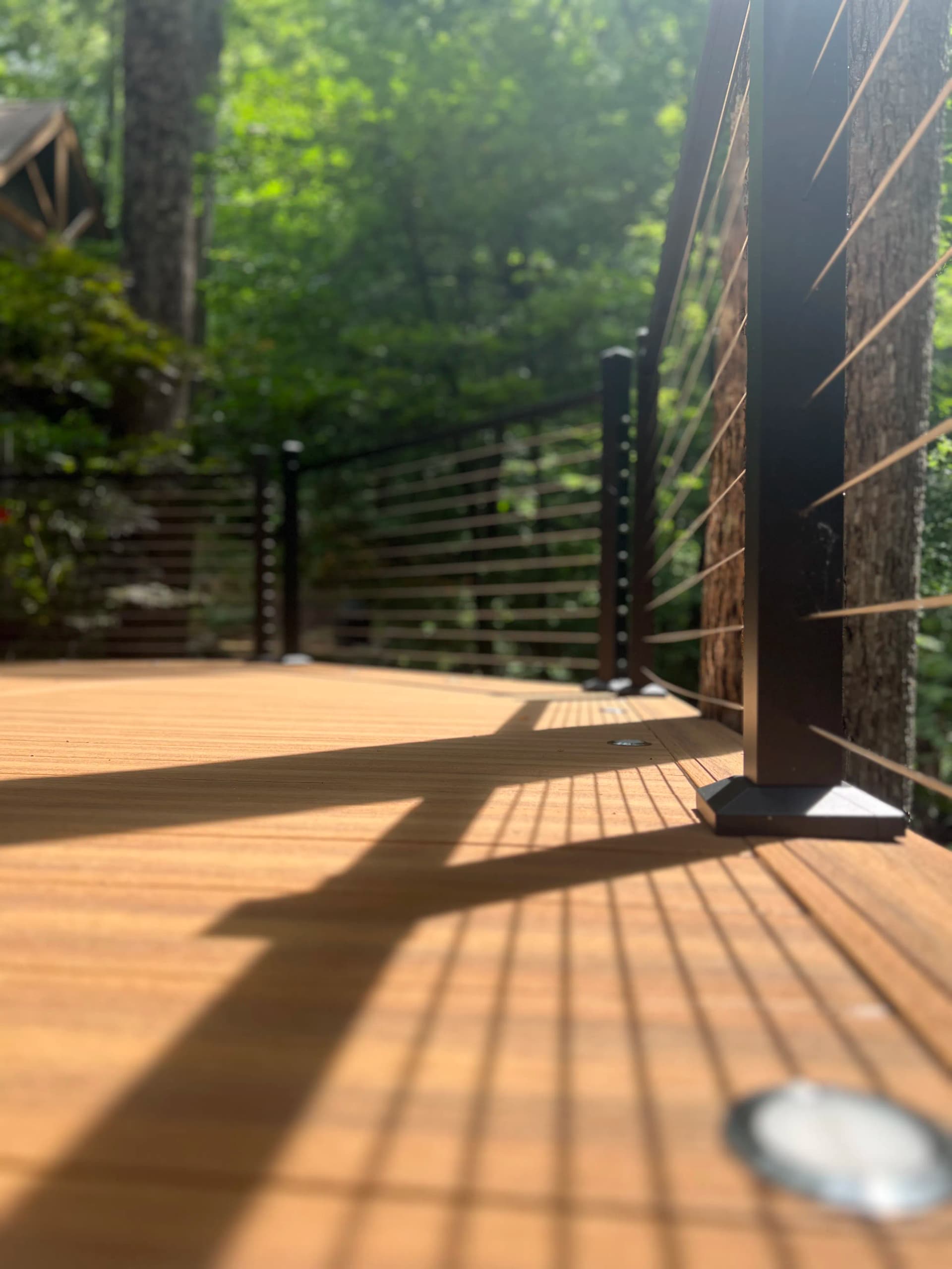 Custom Cable Rail Deck Built Into the Tree Line in Lake Lure