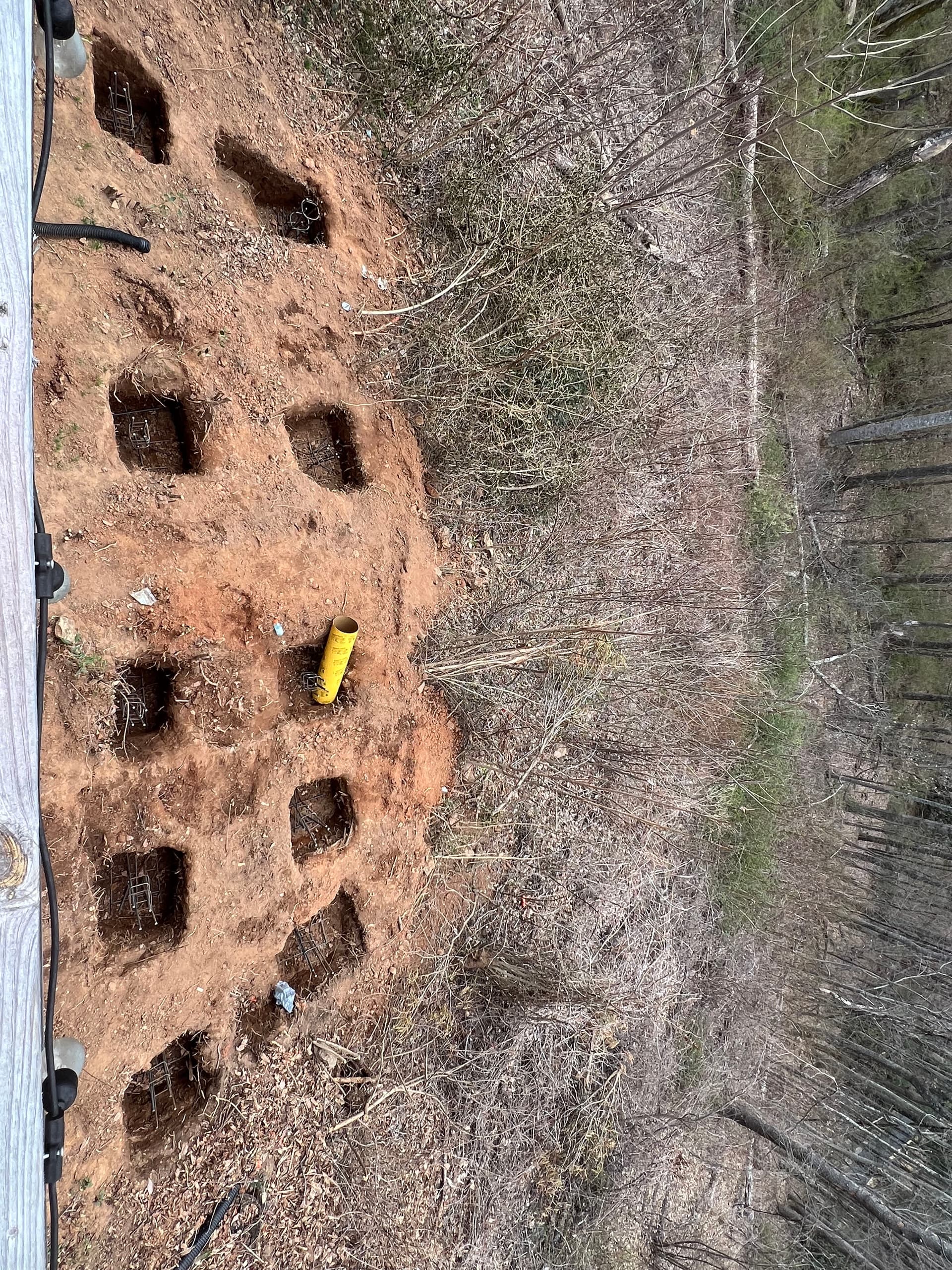Hand-Dug Footers for a Custom Trex Deck on Mountain Terrain image