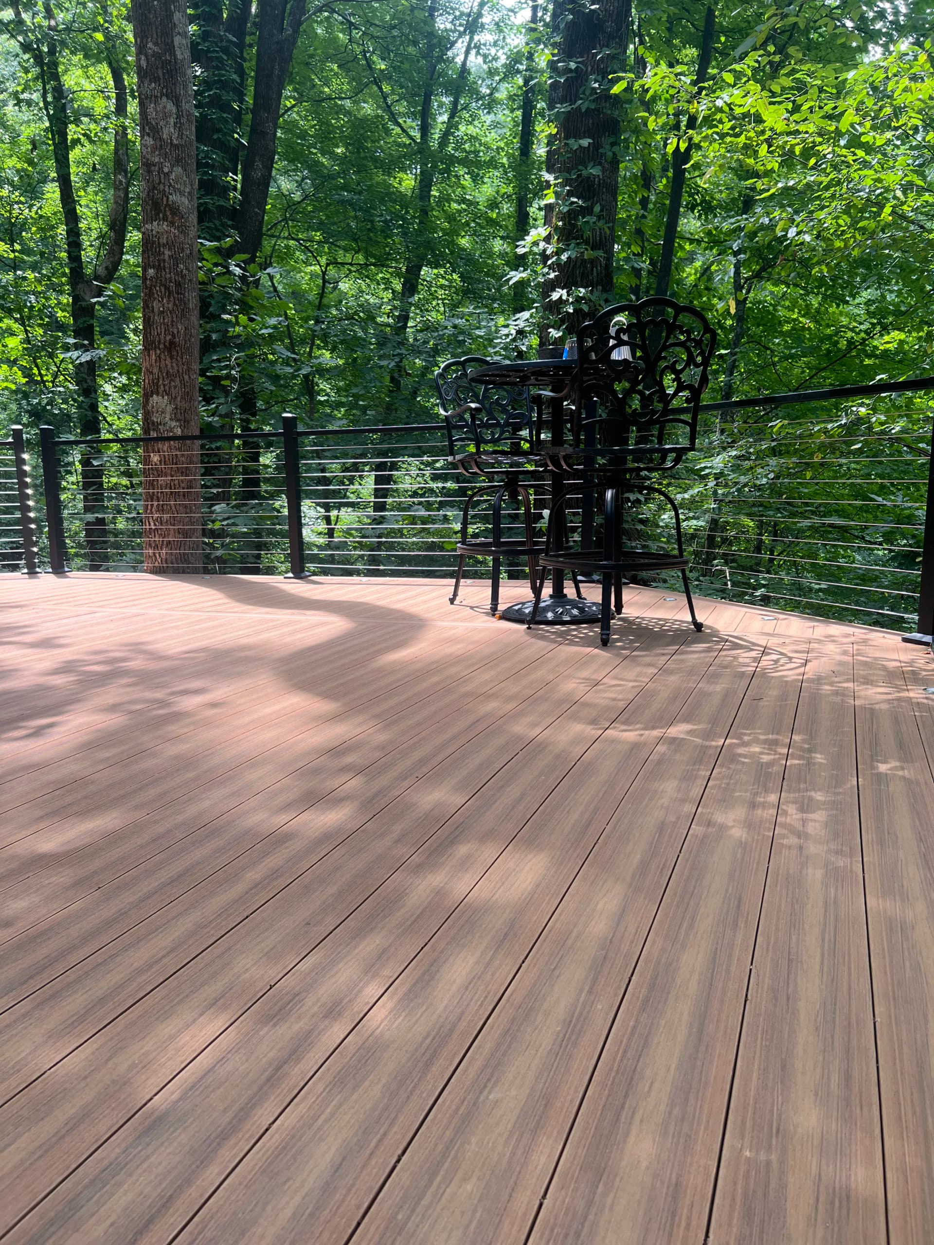 Custom Cable Rail Deck Built Into the Tree Line in Lake Lure