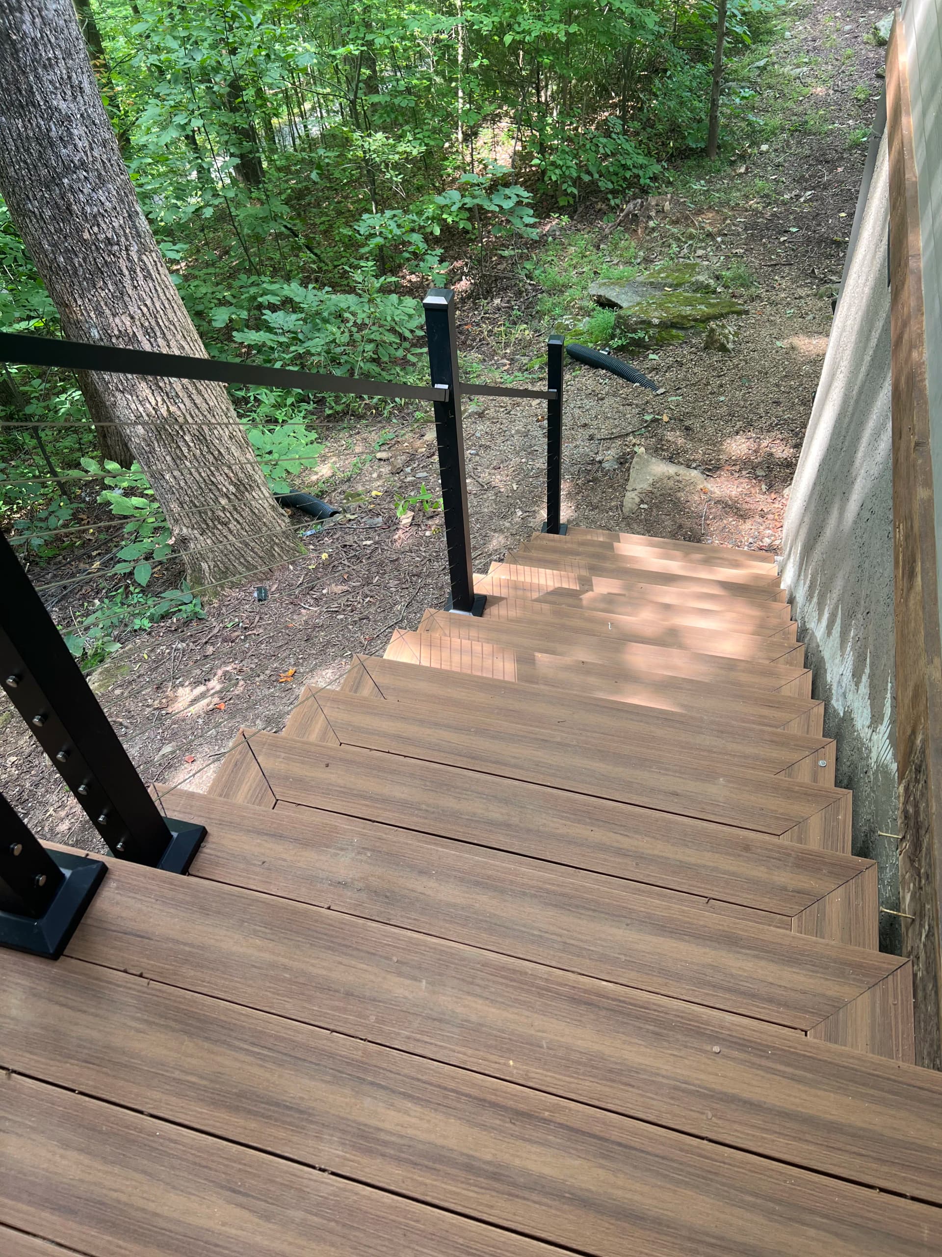 Custom Cable Rail Deck Built Into the Tree Line in Lake Lure